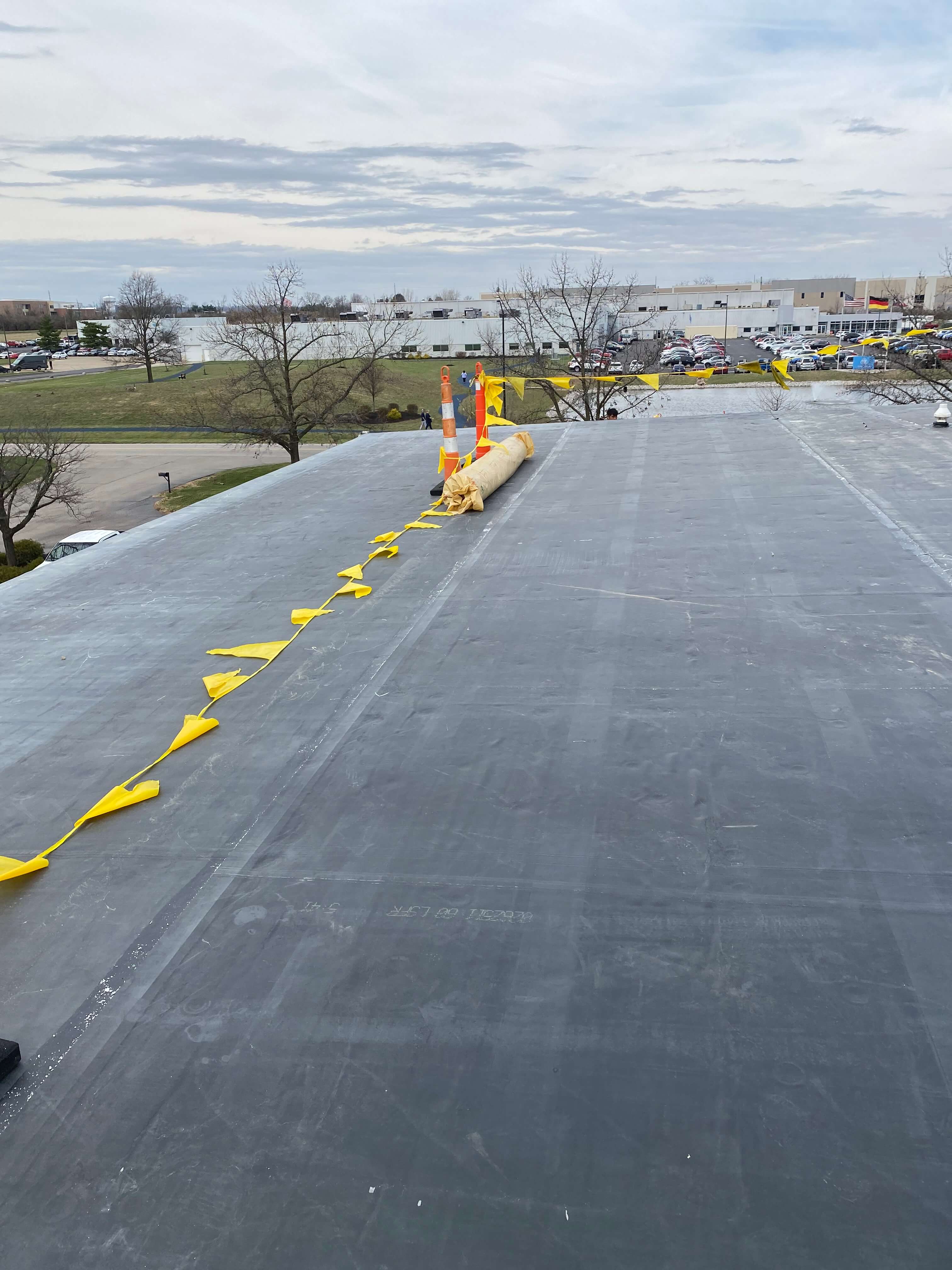 modified bitumen roofers working on a roof
